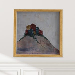City on a Hill abstracted landscape art print on wall by Alice Arlene Briggs, welcoming Italian hill town in blues and reds, available framed or unframed